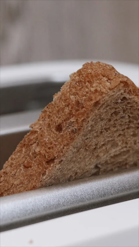 Freshly Toasted Bread Slice In Modern Toaster. Vertical.   Stock Footage 285235197
