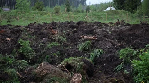 Freshly turned turf and exposed soil with fence and shelter Vídeos de archivo 337582280
