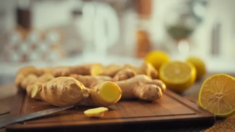 Freshly unearthed brown ginger roots rich in minerals lie on a kitchen table Video stock 331351587
