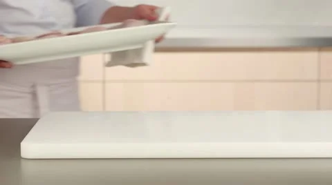 Freshly washed chicken being dried Stock Footage 24656966
