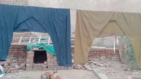 Freshly Washed Clothes Hanging on a Clothesline to Dry Outdoors Stock Footage 346338961
