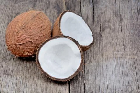Freshness coconut on rustic table Stock Photos