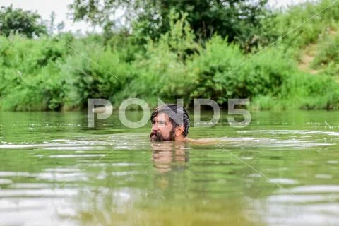 Freshness of wild nature. Summer vacation. Deep dangerous water. Relaxation and Stock Photos