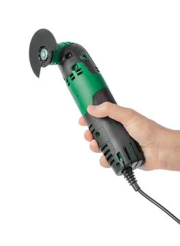 Fretsaw power tool in hand Stock Photos