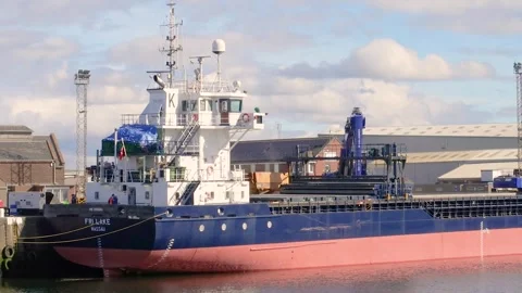 FRI LAKE cargo ship unloading at Port of Ayr, Scotland, UK Stock Footage 285649232