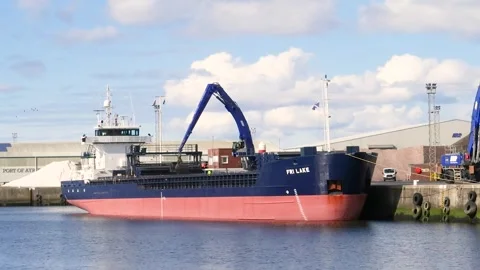 FRI LAKE cargo ship unloading at Port of Ayr, Scotland, UK Stock Footage 285649385