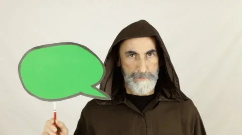 Friar holding green speech balloon serious Stock Footage 48200701