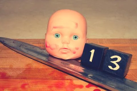 Friday the 13th. A maniac, an cannibal in the kitchen, cuts the body with a k Foto stock