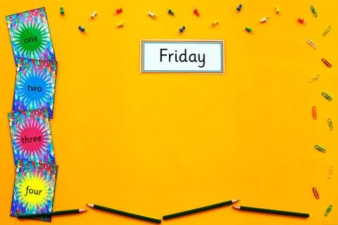 Friday learning flatlay on yellow background. Stock Photos