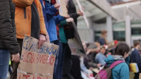 Fridays for the future, school protest. Adults and Teens holding signs Stock Footage 105380040