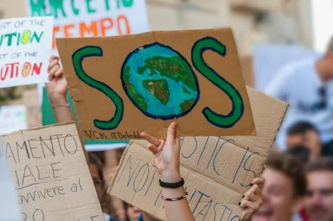 Fridays for future: students hands showing  banners and boards; SOS Stock Photos