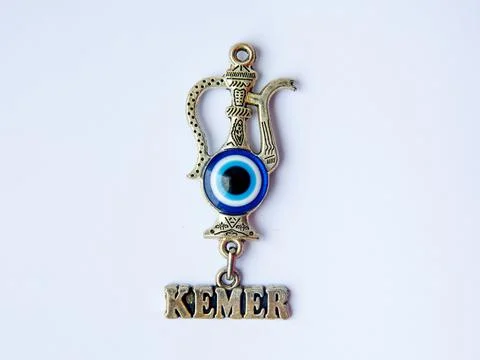 Fridge magnet souvenir in shape eastern turkish jug with blue evil eye Nazar Stock Photos