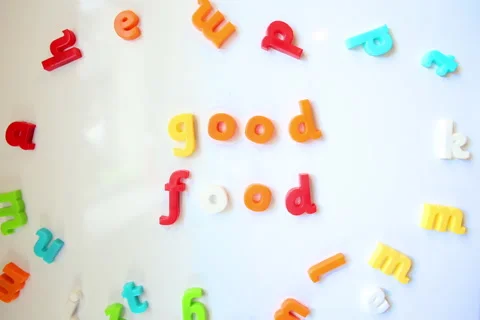 Fridge magnets stop-motion to form words "Good Food" Stock Footage 156711229