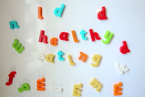 Fridge magnets stop-motion to form words "Healthy eating" Stock Footage 156711321