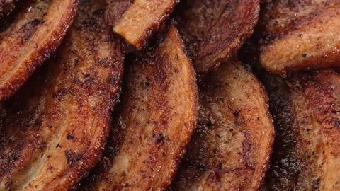 Fried bacon close up rotating Video stock 135801763