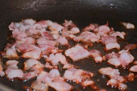 Fried bacon pieces Stock Photos
