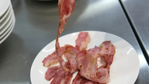 Fried bacon slice of pork bacon is prepared in its own fat. Layer of meat and Stock Footage 287089978