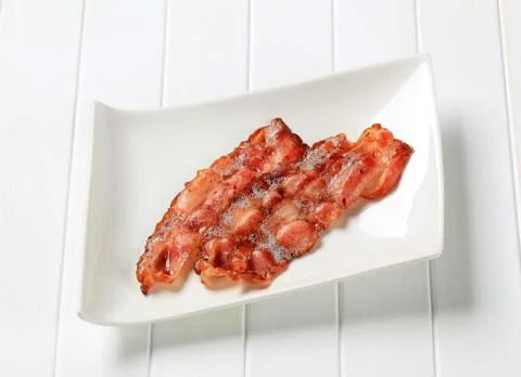 Fried bacon strips Stock Photos