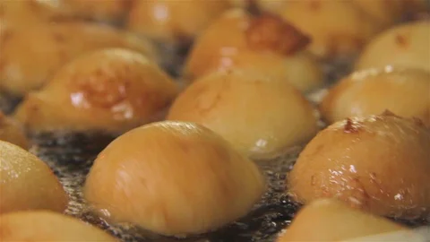 Fried balls rotating inside of frying pan. Stock Footage 123396214