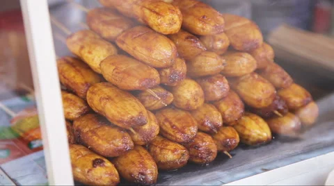 Fried bananas in the street market Stock Footage 59180341