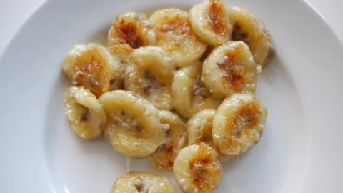 Fried bananas on a white plate Stock Footage 152091708