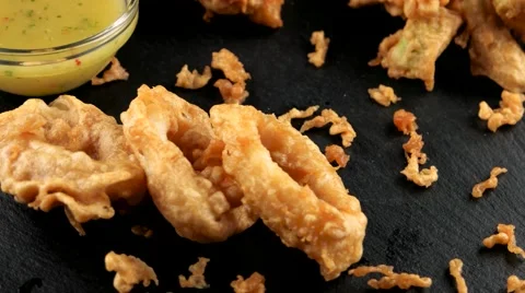 Fried in batter squid and onion rings with a sauce Stock Footage 66480972