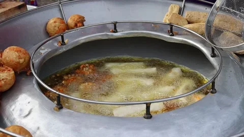 Fried bean curd in metal pan and hot oil. Is delicious food Stock Footage 141306097