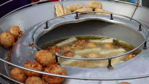 Fried bean curd in metal pan and hot oil Stock Footage 141306116