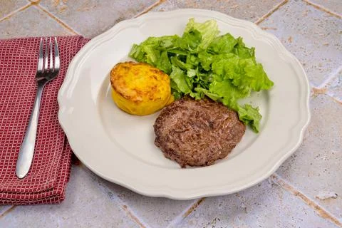 Fried beef  with mashed potatoes and salad leaves Stock Photos