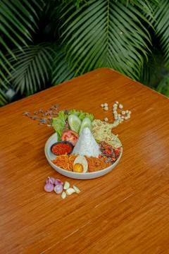 Fried Beef Served with Rice, Crispy Skin, Egg, Cracker, Fresh Salad, and Sp.. Stock Photos
