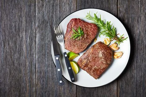 Fried beef steaks on a plate, top view Stock Photos