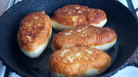 Fried on both sides turn over patties with a fork Stock Footage 72805852