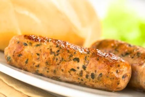 Fried bratwurst with bun Stock Photos