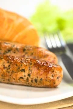 Fried bratwurst with bun Stock Photos