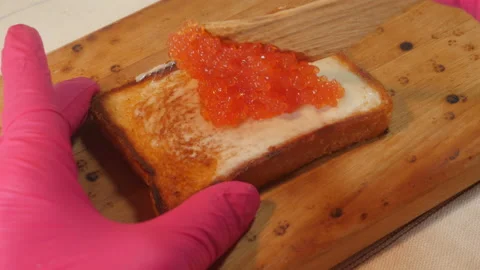 Fried bread with caviar 4K Video stock 141280604