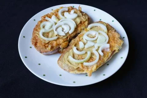Fried bread with egg and onion Stock Photos
