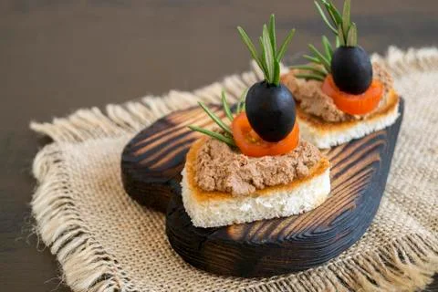 Fried bread with meat pate in the shape of a heart. Stock Photos