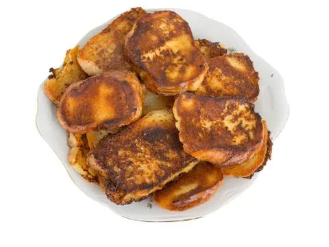 Fried bread in the milk on a plate Stock Photos