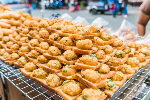 Fried bread with minced pork spread for sale at a local market. Stock Photos