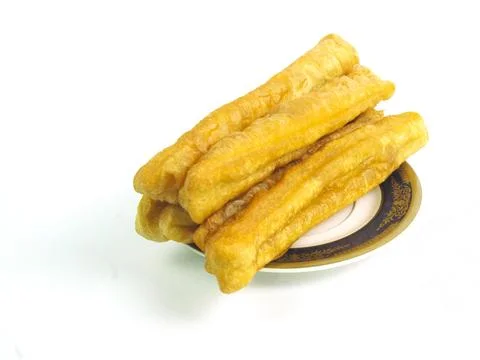 Fried bread or cakwe isolated on a white background. Also known as Youtiao .. Stock Photos