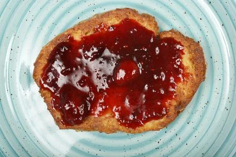 Fried bread slice with berry jam Stock Photos