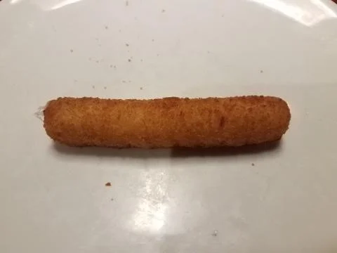 Fried breaded mozzarella cheese stick on white plate Stock Photos