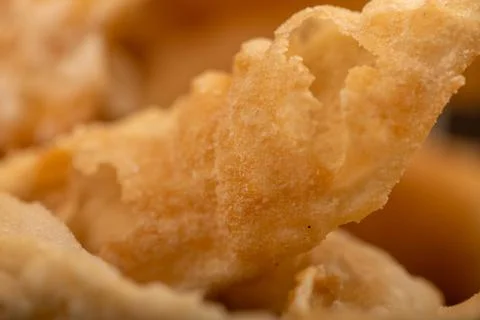 Fried breadsticks with salt, close-up, selective focus. Stock Photos