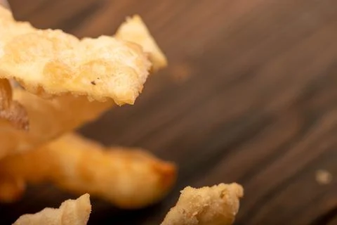 Fried breadsticks with salt, close-up, selective focus. Stock Photos