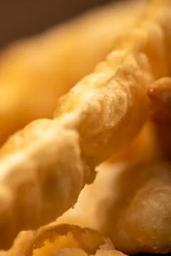 Fried breadsticks with salt, close-up, selective focus. Stock Photos