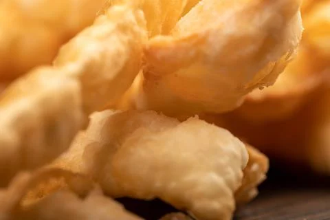 Fried breadsticks with salt, close-up, selective focus. Stock Photos