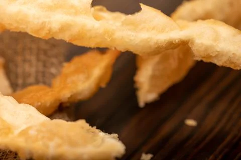 Fried breadsticks with salt, close-up, selective focus. Stock Photos
