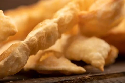 Fried breadsticks with salt, close-up, selective focus. Stock Photos