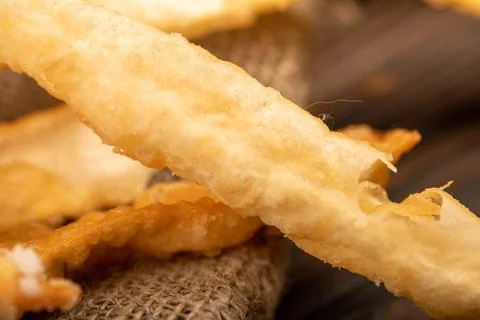 Fried breadsticks with salt, close-up, selective focus. Stock Photos
