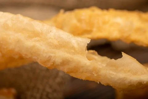 Fried breadsticks with salt, close-up, selective focus. Stock Photos